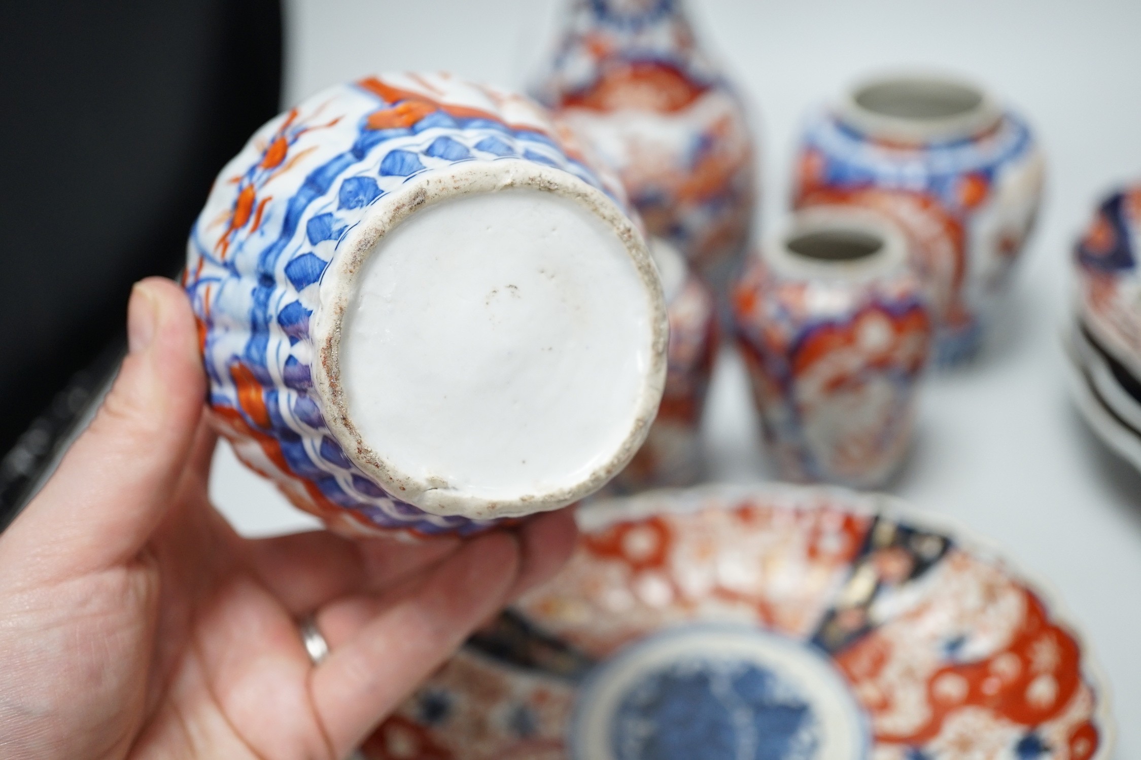 A group of Imari vases and dishes, tallest 19cm